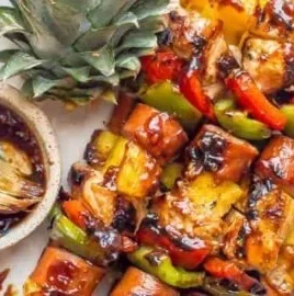 Teriyaki chicken pineapple kabobs skewered and ready for grilling