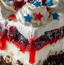 4th of July dessert lasagna with layers of red, white, and blue ingredients