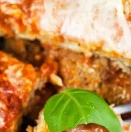 Gluten-free Baked Eggplant Parmesan served with fresh herbs