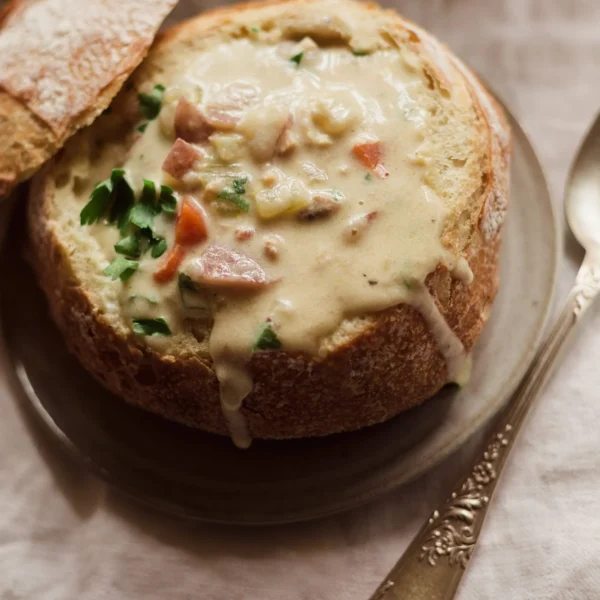 Classic New England clam chowder served in a crusty bread bowl