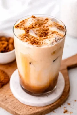 Creamy Biscoff coffee creamer in a glass with coffee