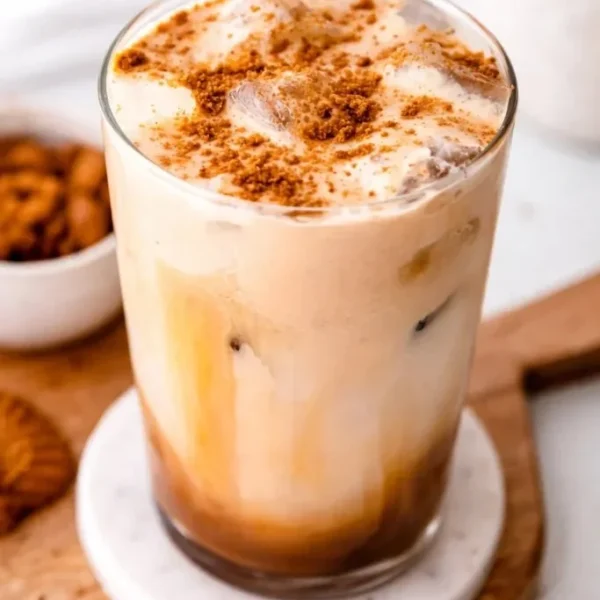 Creamy Biscoff coffee creamer in a glass with coffee