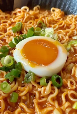 Creamy Buldak Noodles served in a bowl with colorful ingredients