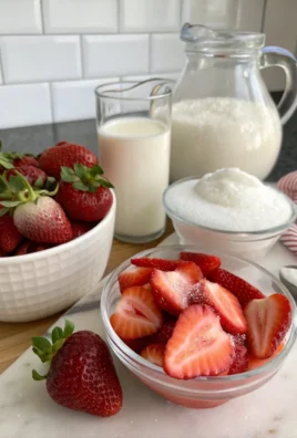 Strawberry cold foam topped cold brew coffee in a glass