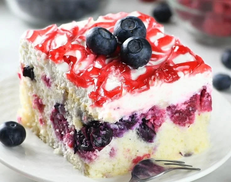 Easy summer berry sheet cake topped with fresh strawberries, blueberries, and raspberries