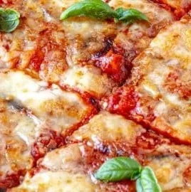Delicious Eggplant Parmesan with layers of eggplant, marinara sauce, and melted cheese.