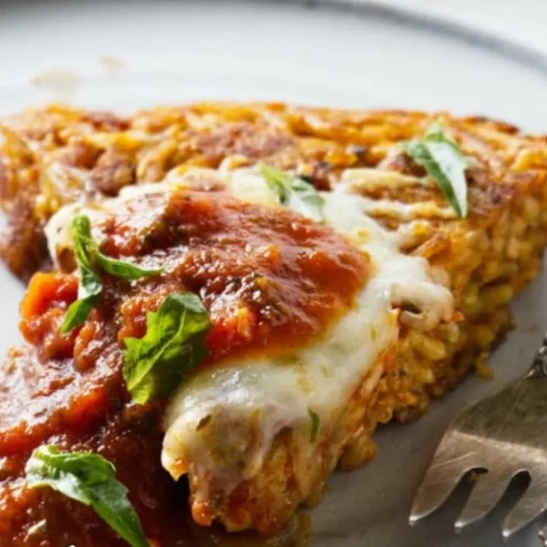 Delicious plate of fried spaghetti garnished with fresh herbs