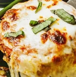 Delicious baked eggplant parmesan topped with marinara sauce and melted cheese