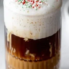 Iced Sugar Cookie Cold Foam Oasis with decorative sprinkles and fluffy foam