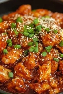 Delicious serving of Korean Fire Chicken, garnished and ready to enjoy