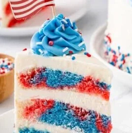 Layered red, white, and blue marble cake with vibrant colors and rich texture