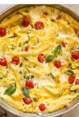 Delicious leftover pasta frittata served with fresh herbs