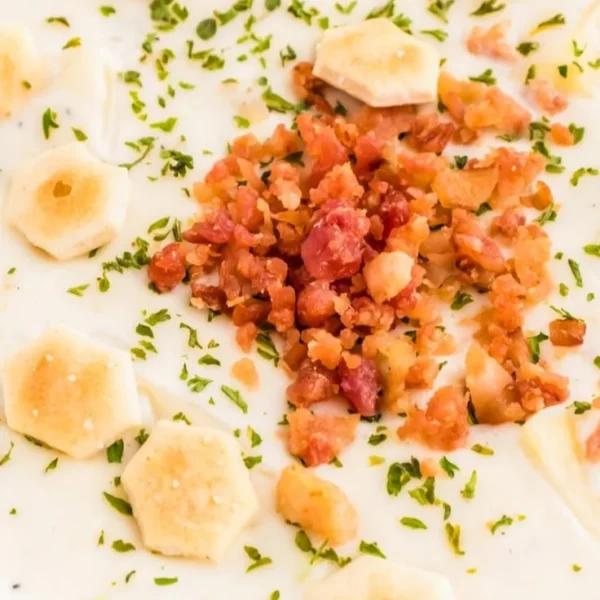 Bowl of creamy New England clam chowder with clams and potatoes