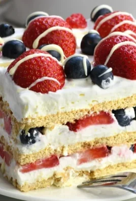 No-Bake 4th of July Icebox Cake decorated with berries and whipped cream