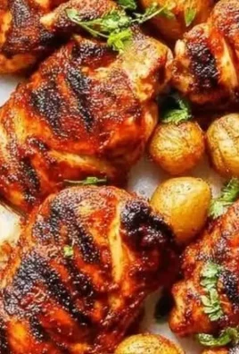 Juicy Peri Peri Chicken served with spicy sauce and fresh herbs