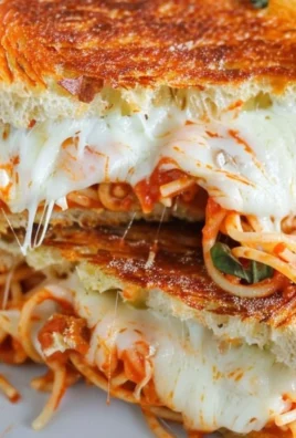 Delicious spaghetti grilled cheese sandwich with melted cheese and pasta