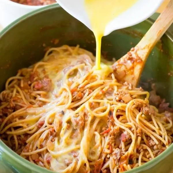 Delicious spaghetti pie served on a plate with a garnish