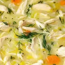 Delicious Avgolemono, Greek lemon chicken soup, served in a bowl
