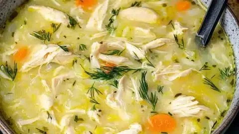 Delicious Avgolemono, Greek lemon chicken soup, served in a bowl